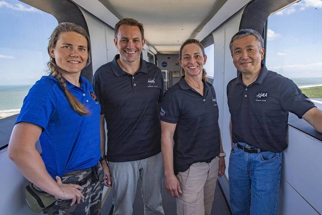 Anna Kikina, left, Josh Cassada, Nicole Mann and Koichi Wakata are pictured inside the crew access wing at the Kennedy Space Center's Launch Complex.