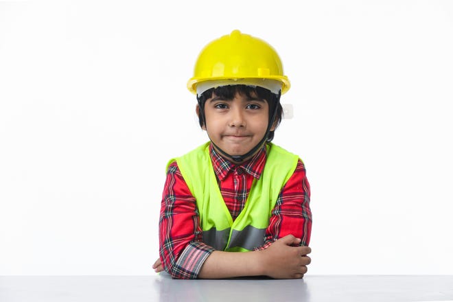 Child dressed as construction engineer