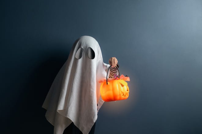 A boy in ghost costume