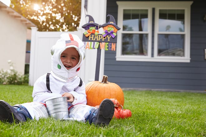 Boy dressed in astronaut costume