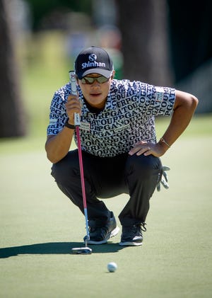 S.H. Kim lines up a putt on the 9th in the first round of tournament play during the Sanderson Farms Championship at the Country Club of Jackson in Jackson, Miss., Thursday, Sept. 29, 2022. 