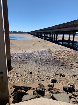 The bridge that connects Wakulla and Franklin counties spanned across a waterless Ochlockonee Bay.