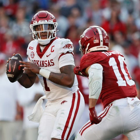 Arkansas quarterback KJ Jefferson (1) rolls out to