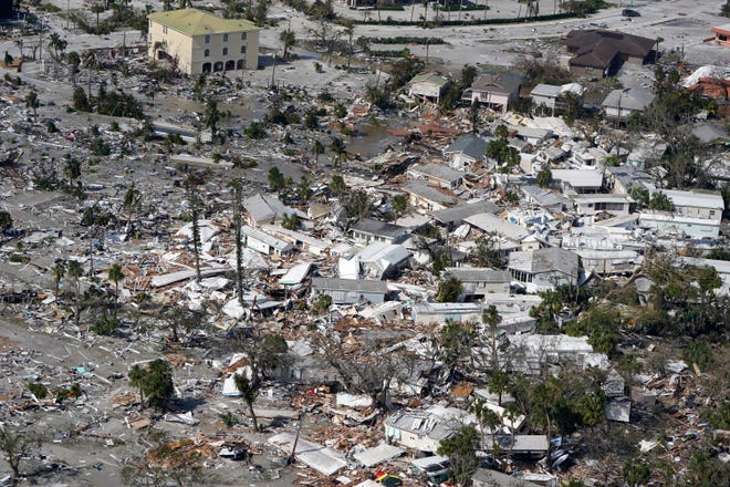 Damaged homes and debris are displayed in the aftermath of Hurricane Ian, Thursday, September 29, 2022, in Fort Myers, Fla.