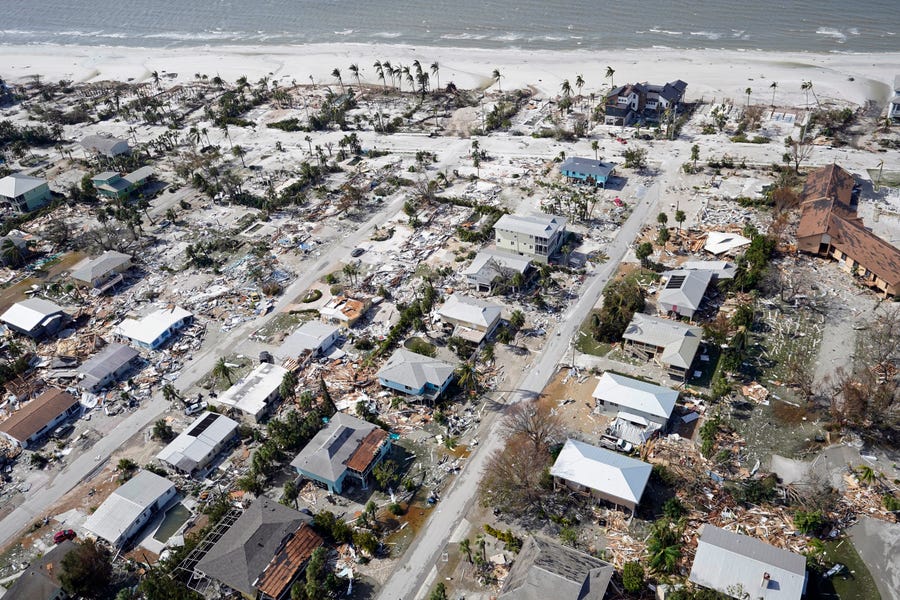 Damaged homes and debris in the aftermath of Hurricane Ian, Thursday, Sept. 29, 2022, in Fort Myers, Fla.