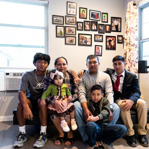 Deysi Garcia, center, and her family at their home
