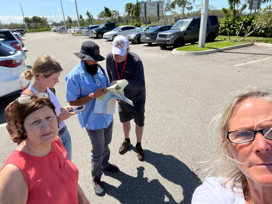 Editors Wendy Fullerton Powell, Cindy McCurry Ross at the forefront. In the background is Mark Bickel Giving directions to our colleagues from the Palm Beach Post who just arrived, Hannah Morse and Andreas Lieva.