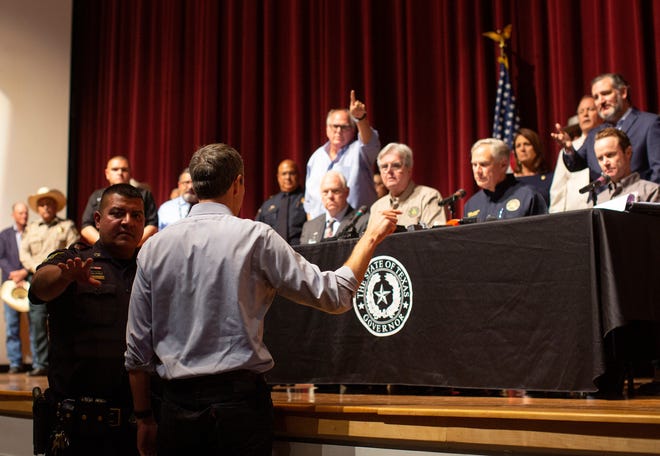Democrat Beto O'Rourke, who is running against  Texas Gov. Greg Abbott for governor this year, interrupts a news conference headed by Abbott in Uvalde, Texas Wednesday, May 25, 2022. (AP Photo/Dario Lopez-Mills) ORG XMIT: TXDL203