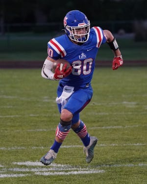 Lenawee Christian's Collin Davis runs with the ball during Week 5's game against Camden Frontier.