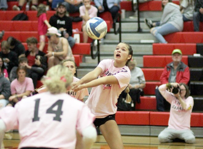 Holli Sellers keeps a ball alive against Bloomingdale in prep volleyball action on Thursday.