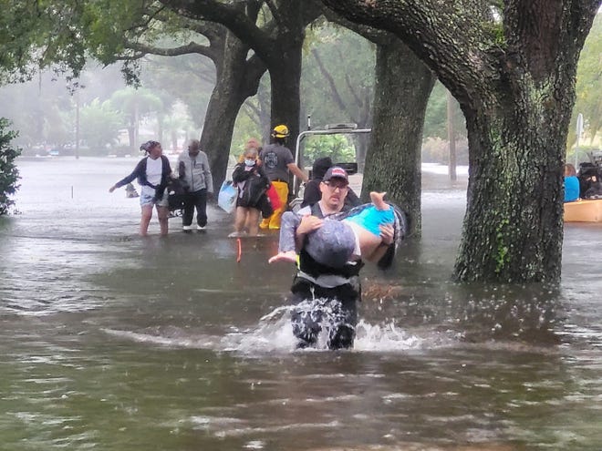 As rain from Hurricane Ian continued to fall, Orange County Fire Rescue firefighters worked around the clock on September 29, 2022, rescuing residents from their flooded homes in Central Florida .