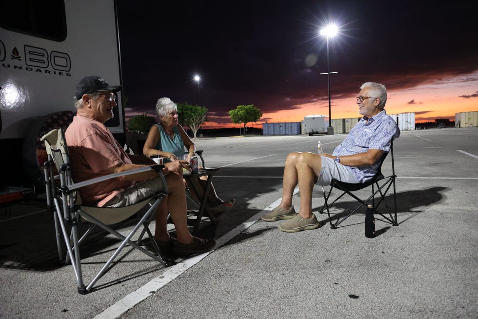 Hurricane Ian evacuees with trailers and motorhomes set up camp in the parking lot of the Miccosukee Resort & Gaming casino in Florida.