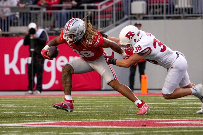 Oct 1, 2022; Columbus, Ohio, USA; Ohio State Buckeyes tight end Gee Scott Jr. (88) is tackled by Rutgers Scarlet Knights linebacker Austin Dean (38) during the fourth quarter of the NCAA Division I football game between the Ohio State Buckeyes and the Rutgers Scarlet Knights at Ohio Stadium. Mandatory Credit: Joseph Scheller-The Columbus Dispatch