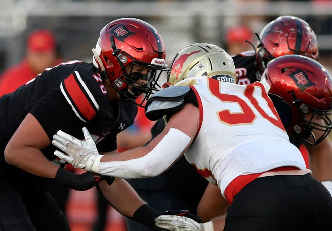 Lubbock-Cooper offensive lineman Holton Hendrix, left, blocks Coronado's Chad Williams during the Pirates' 15-14 victory on Sept. 30. Hendrix made a commitment to Texas Tech on Sunday.