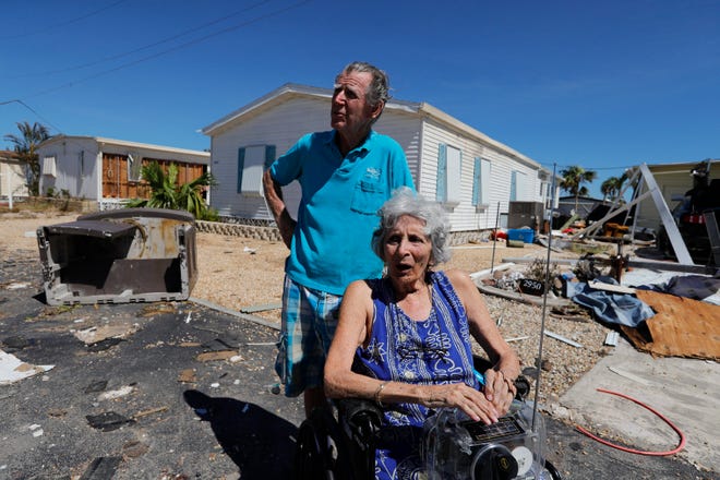 Vivian and Tom Bridges survey the damage around their mobile home park on Friday, September 30, 2022.  Pine Island showed major signs of damage following strong winds and flood waters as a result of Hurricane Ian's impact on the island.