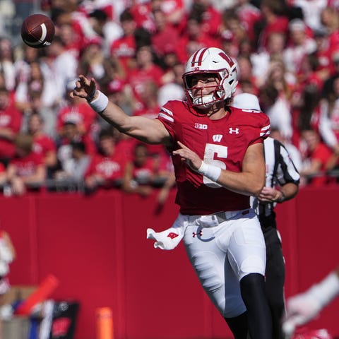 Wisconsin quarterback Graham Mertz (5) throws an i