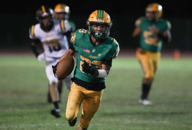 Coachella Valley's Aaron Ramirez, running the ball against Yucca Valley on Sept. 30, 2022, broke a number of school records this season.