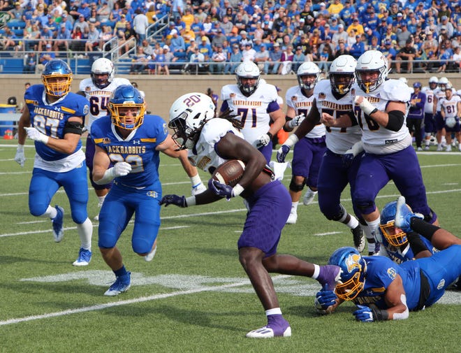 Western Illinois' Erin Collins is tracked down by South Dakota State linebacker Adam Bock (32) in the second quarter of Saturday's game at Dana J. Dykhouse Stadium in Brookings.