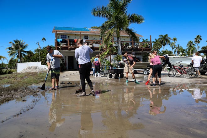 Residents and business owners of the city of Everglades clean up from Hurricane Ian.