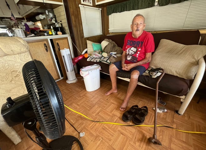 Bob Palmer, 83, poses for a photo in his Ft. Myers, Florida, mobile home, two days after Hurricane Ian.