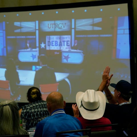 Supporters of Texas Gov. Greg Abbott watch his deb