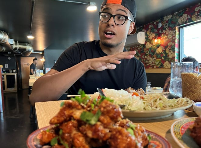 Chef Gabriel Lewis expresses his satisfaction with lunch at Ma Der Lao Kitchen in Oklahoma City.