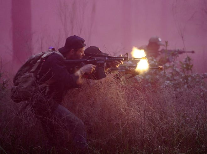Special Forces candidates assigned to the U.S. Army John F. Kennedy Special Warfare Center and School engage enemy role players during the final phase of field training known as Robin Sage on April 26, 2022.