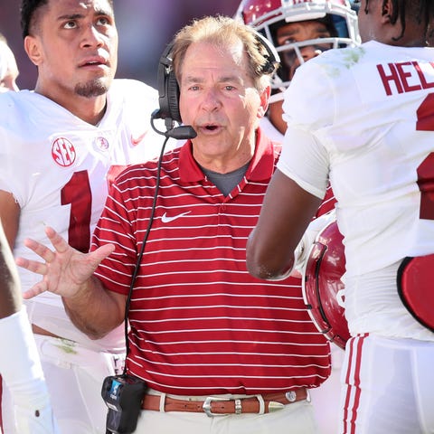 Alabama head coach Nick Saban talks to his players