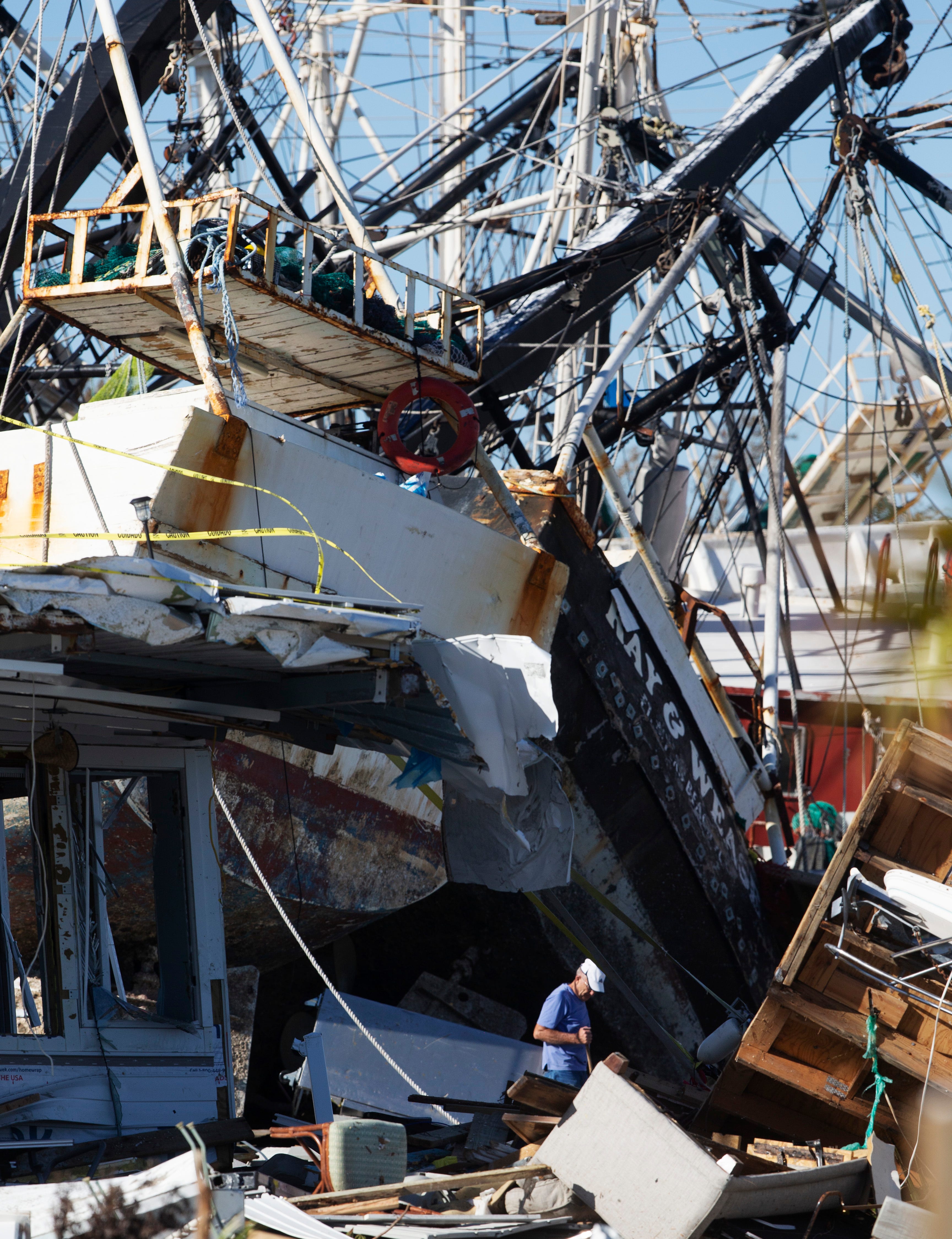 Ron Winegardner, a resident of Gulf Cove Mobile Home Park on San Carlos Island on Fort Myers Beach tries to reach his boat on Sunday, October 2, 2022 that was swept away by Hurricane Ian. His home was completely destroyed in the storm.