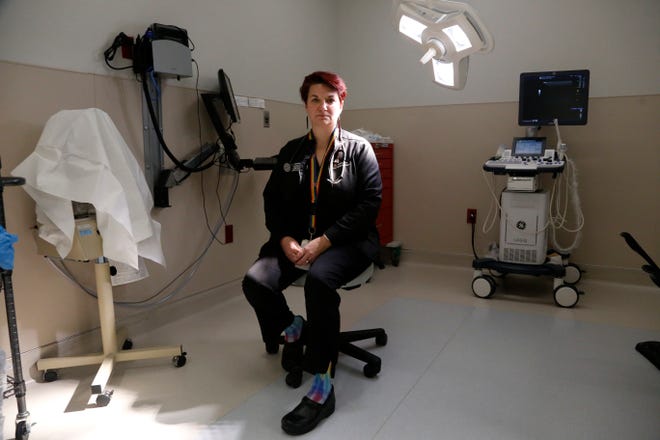FILE - Dr. Colleen McNicholas, chief medical officer at Planned Parenthood of the St. Louis Region and Southwest Missouri, sits in a surgical room on April 11, 2022, at the Planned Parenthood clinic in Fairview Heights, Ill. Midwestern Planned Parenthood officials on Monday, Oct. 3, 2022, announced plans for a mobile abortion clinic â€” a 37-foot RV that will stay in Illinois but travel to near the border of adjoining states that have banned the procedure since the Supreme Court overturned Roe v. Wade earlier this year. (AP Photo/Martha Irvine, File)