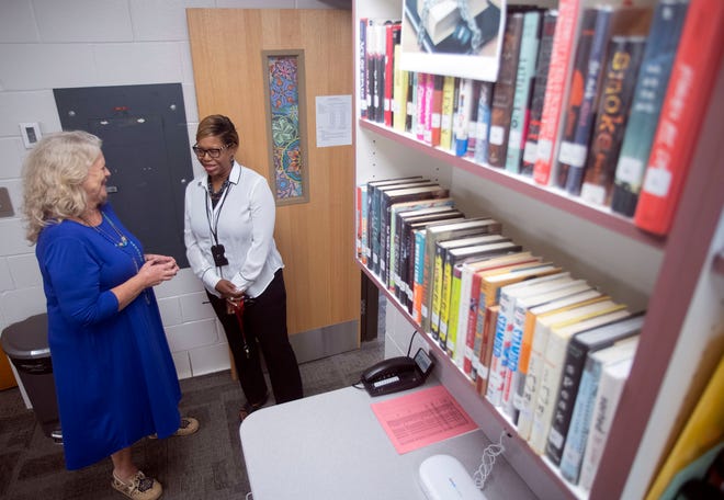 West Florida High School Innovation Specialist Linda Quinn and Principal Esi Shannon discuss the placement of restricted books in the school's media center on Monday, Oct. 3, 2022. 