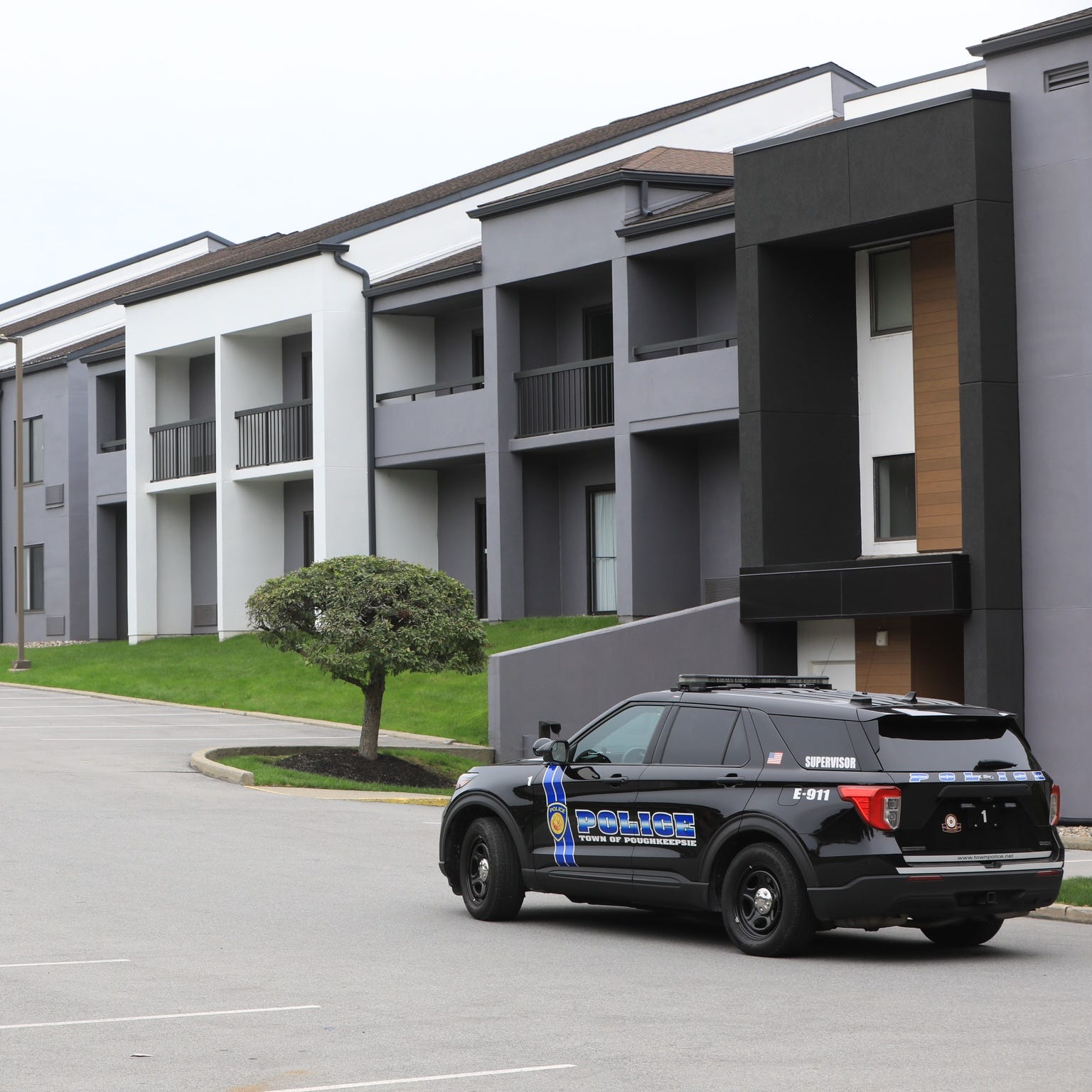 Town of Poughkeepsie police vehicles were stationed outside a Courtyard by Marriott Monday where on Sunday a shooting resulted in one guest killed.