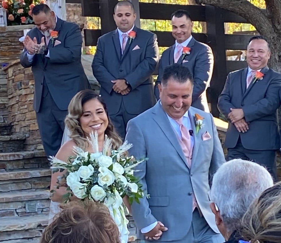 Robert and Rosa Aguilar smile after exchanging wedding vows in Camarillo, California on Oct. 1, 2022, five years to the day after the couple survived the worst mass shooting in U.S. history.