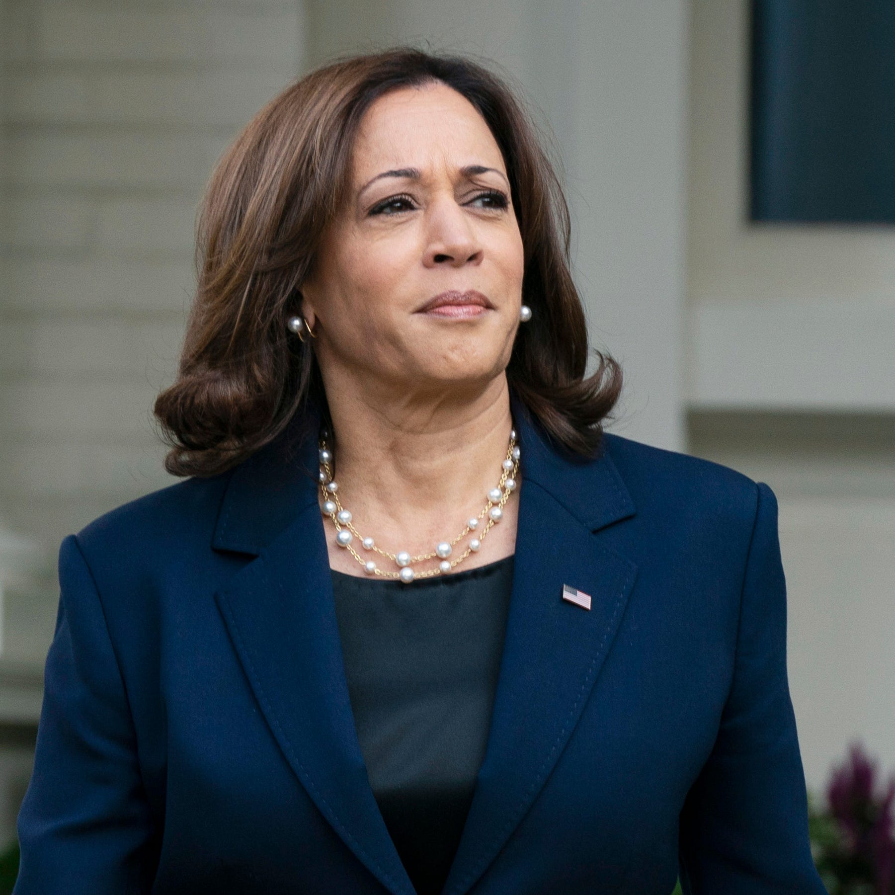 FILE - Vice President Kamala Harris waits outside the Vice President's official residence Sept. 16, 2022, in Washington. Harris is leading a U.S. delegation to Tokyo for the funeral of former Japanese prime minister Shinzo Abe, who was assassinated in July.