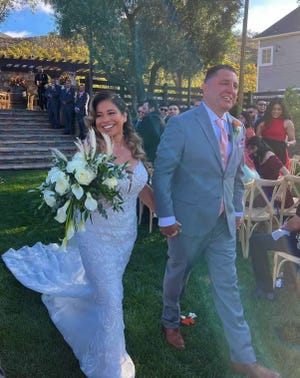 Robert and Rosa Aguilar smile after exchanging their wedding vows in Camarillo, California on October 1, 2022, five years to the day after the couple survived the worst mass shooting in US history.