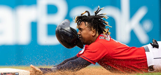 Oct. 2: The Cleveland Guardians' José Ramírez loses his helmet as he slides stealing second base during the seventh inning at Progressive Field. The Guardians won the game, 7-5.