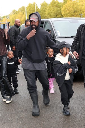 Ye, Saint West, Psalm West and Chicago West attend the Balenciaga Womenswear Spring/Summer 2023 show as part of Paris Fashion Week on October 02, 2022 in Villepinte, France.
