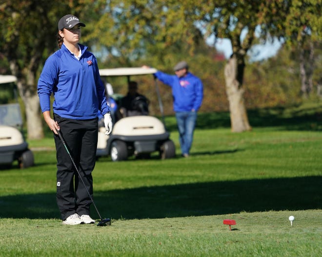 Lenawee Christian's Morgan Bell eyes the hole ahead before teeing off during the Division 4 regional meet at the Hills of Lenawee on Monday.