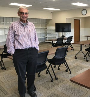 Michael Sigwalt, showing off the classroom area of the Matthew 25 Center, is director of the Geneseo-Atkinson Food Pantry..