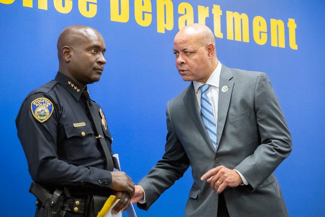 Stockton Police Chief Stanley McFadden, left, talks with city manager Harry Black after a news conference at the Stockton Police department about a possible serial killer in Stockton.