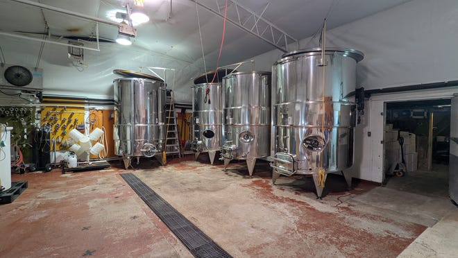 Four large wine tanks serve as the background for comedians who perform at Smoky Hill Vineyards and Winery. The winery has begun hosting small, live entertainment events at its facility, 2771 Centennial Road in Salina.