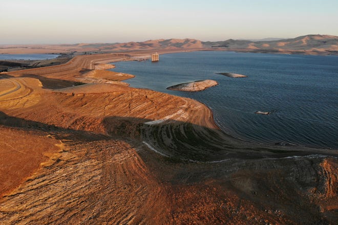 Water levels are low at San Luis Reservoir, which stores irrigation water for San Joaquin Valley farms, in Gustine, Calif., Sept. 14, 2022. As climate change brings hotter temperatures and more severe droughts, cities and states around the world are facing water shortages as lakes and rivers dry up.