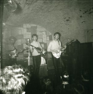 Two previously unseen photos of the Beatles show an early version of the band in the Cavern Club in Liverpool, England.