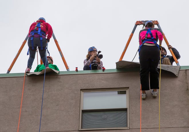 People get ready to rappel off the Robertson’s Apartment building as a part of the Over The Edge charity event for Youth Service Bureau on Friday, Oct. 4, 2019, in downtown South Bend. The event returns for its sixth year as part of Downtown South Bend Inc.'s First Fridays event on Oct. 7, 2022.