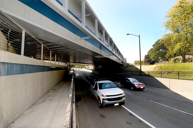 Vehicles pass under the new Sixth Street underpass Wednesday afternoon. A ribbon-cutting ceremony was held for the underpass and its Fifth Street counterpart Wednesday. They make up Usable Segment IV of the Springfield Rail Improvements Project.