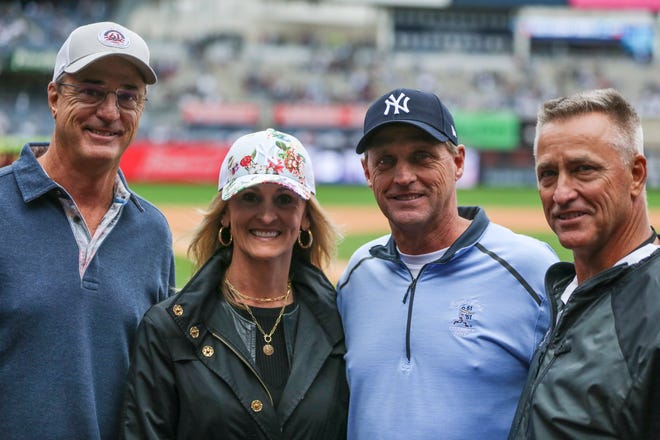 Roger Maris' children are honored before the game between 