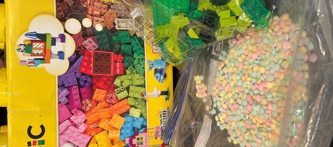 The rainbow-colored fentanyl pills New York authorities found inside a Lego container.