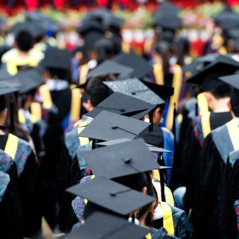 A picture of graduation caps during a commencement