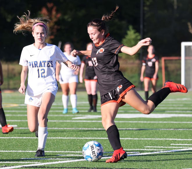 Middleboro's Leah Stearns passes the ball in front of Hull's Maeve White during a game Thursday, Oct. 6, 2022. 