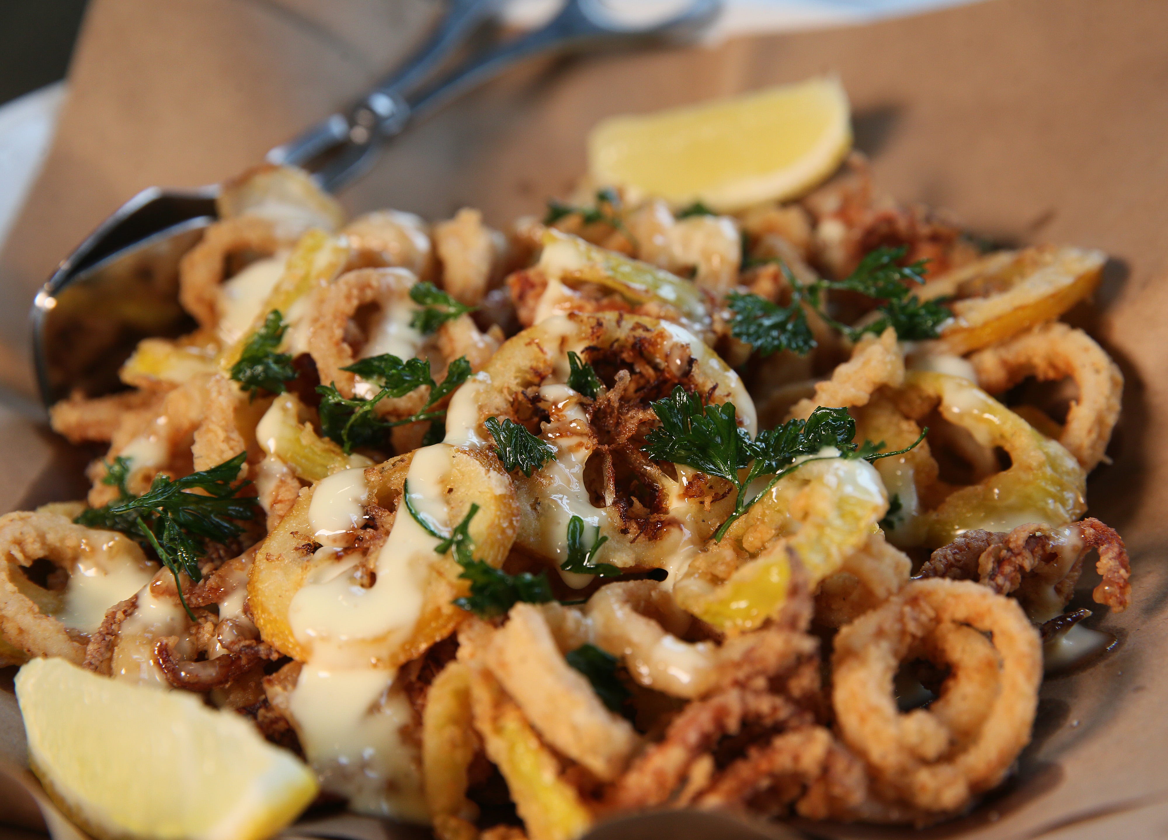 Fried calamari at Buttermint Finer Dining in Shorewood is combined with fried banana peppers, onion and lemon, and garnished with preserved-lemon aioli.
